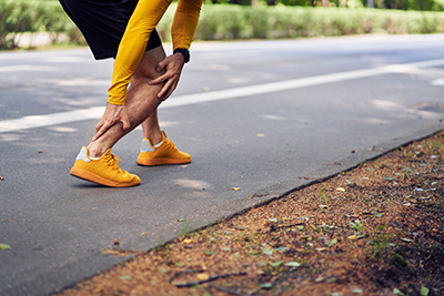 holding achilles tendon