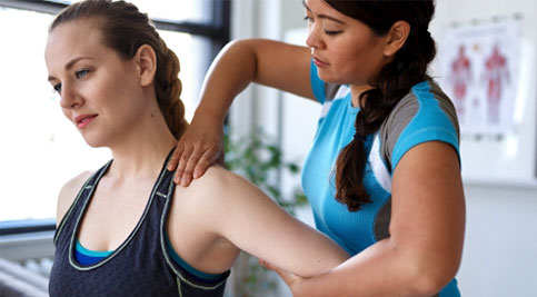 therapist helping a patient