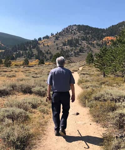 Patient hiking near mountains