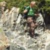 Dr. Bishop climbing a mountain